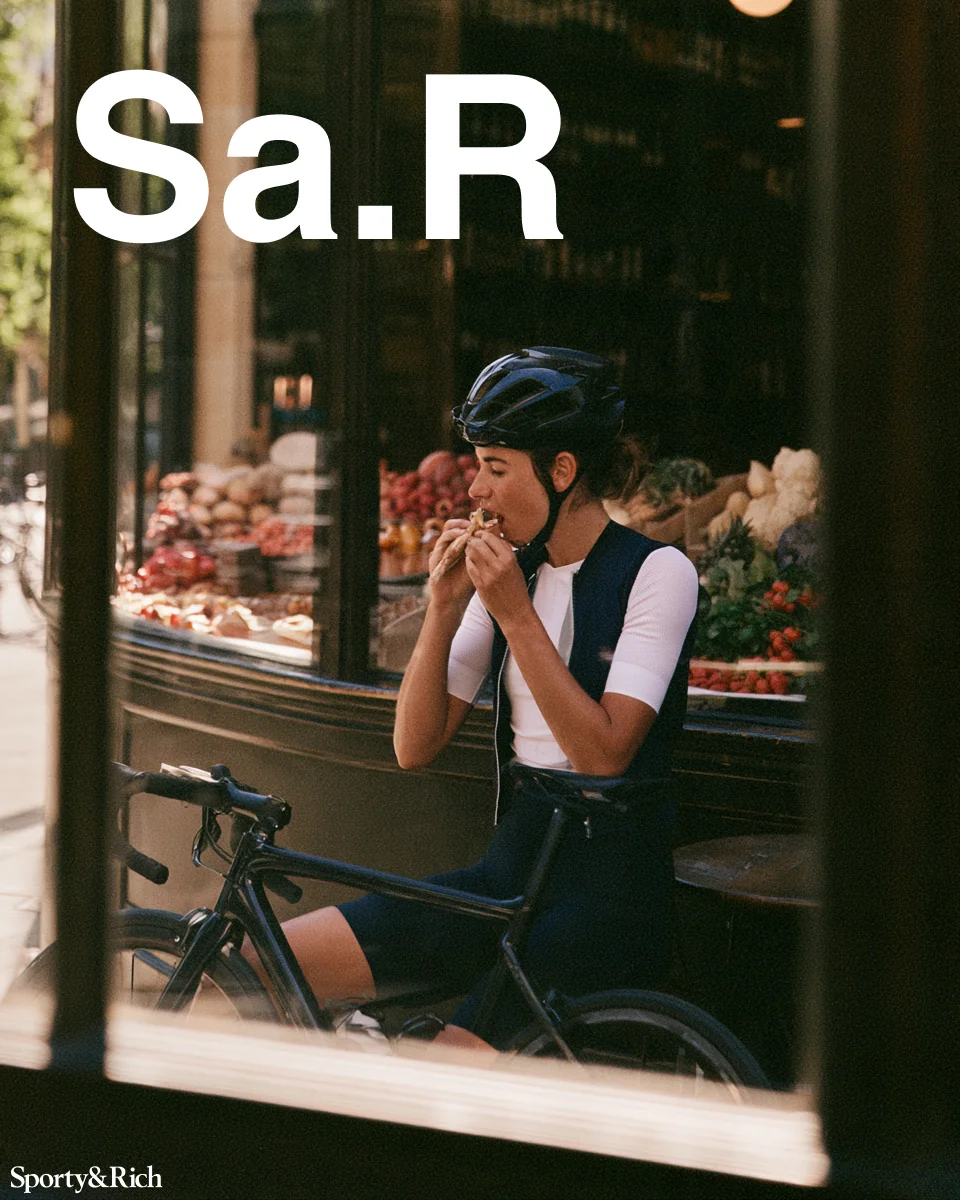 Sporty&Rich — Cyclist taking a break outside a café